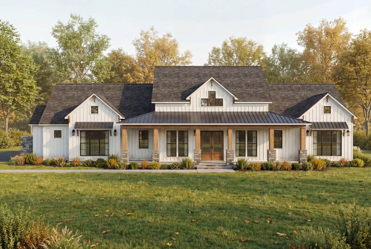A white farmhouse with a black roof and porch, set in front of a grassy yard with trees in the background, autumn colors highlight the scene.