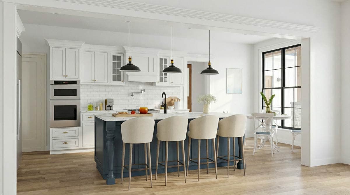 A modern kitchen with a large island and bar stools. White cabinets and subway tile back a sink. Overhead black pendant lights hang above.