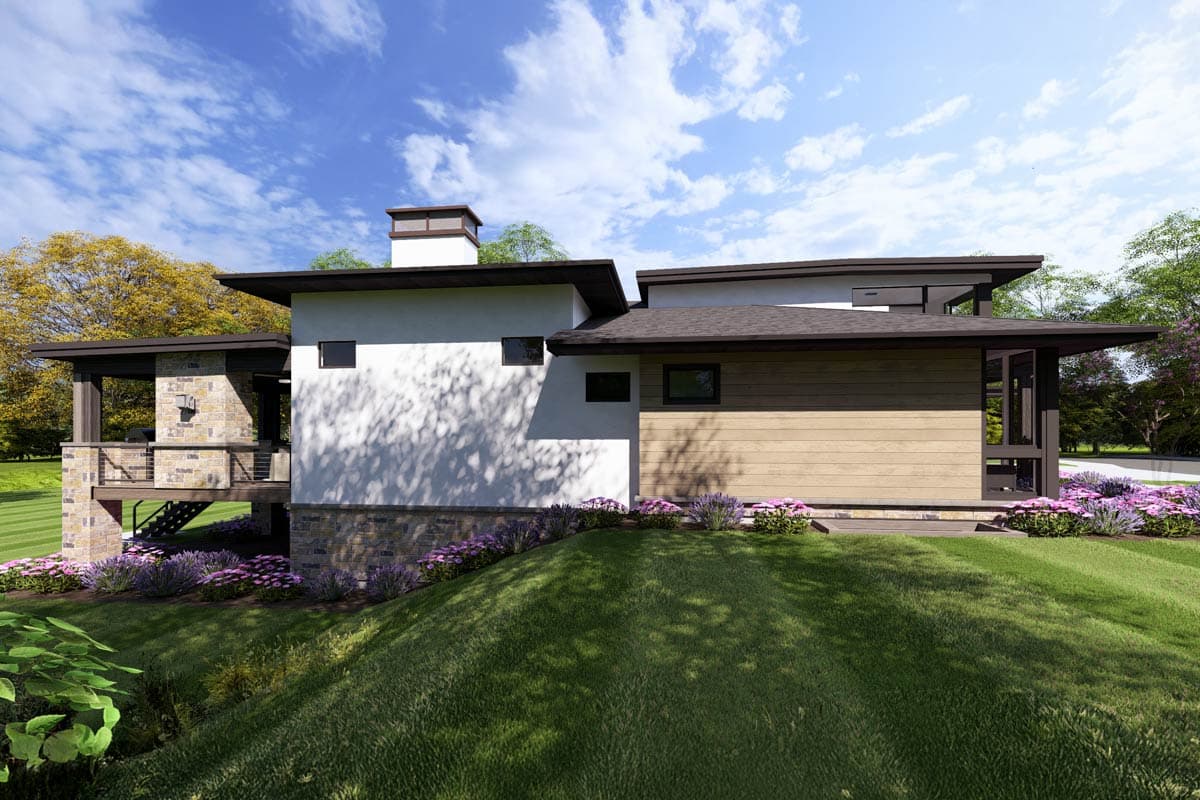 House plan exterior: Modern style, one story, with stone accents, cantilevered roof, and prominent chimney.