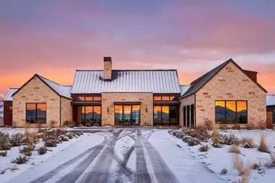 Expansive Contemporary Farmhouse House Plan with Sunroom and 3-Car Garage