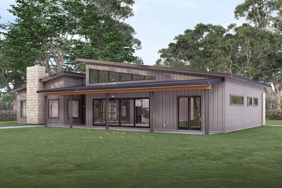 Modern house plan exterior with stone chimney, metal siding, cantilevered roof, and clerestory windows.