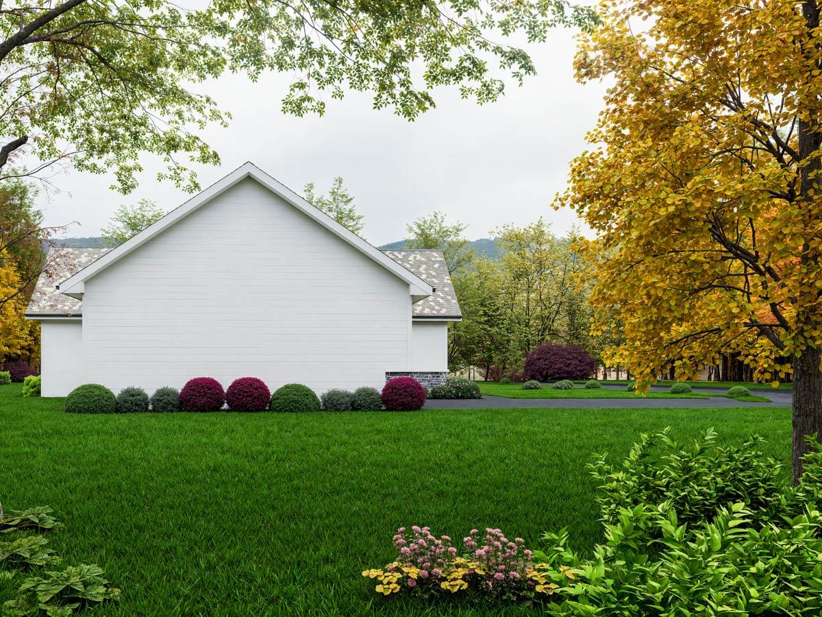 Modern house plan exterior showing a white vinyl-sided gable end with a gray asphalt shingle roof and a line of manicured shrubs.