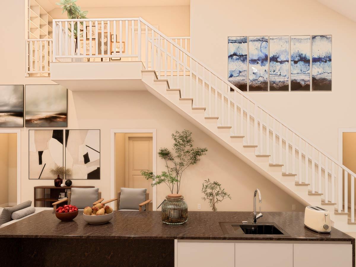 Interior rendering of a multi-level home featuring a floating staircase, open-concept living area with island, and modern art.