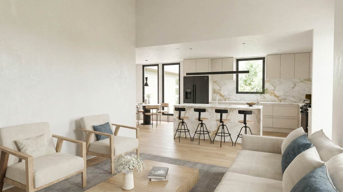 Open concept living space with vaulted ceiling, kitchen island with seating, and dining area with large windows.