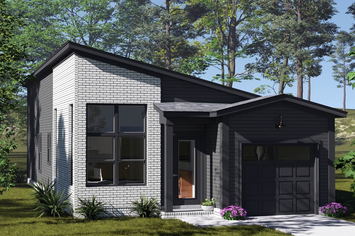 A modern, two-toned house with a black roof, door, and garage door. The facade features white brick and gray siding with large, dark-framed windows.