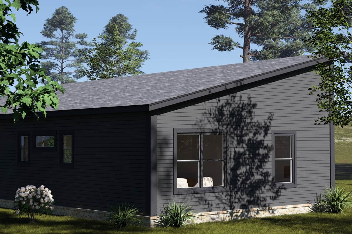 House plan exterior, one story, dark gray horizontal siding, prominent asymmetrical roofline, stone foundation, and multi-pane windows.