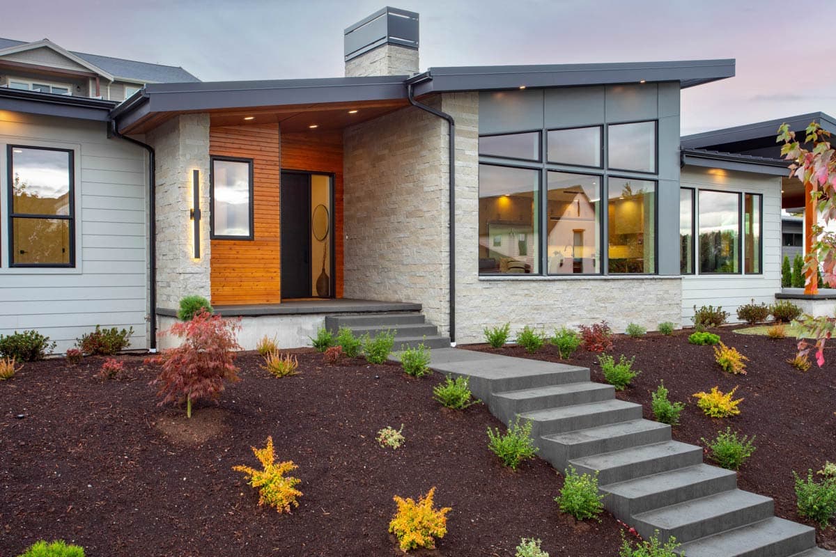 Modern house plan exterior with stone facade, wood accents, large windows, flat roof, and a prominent chimney.