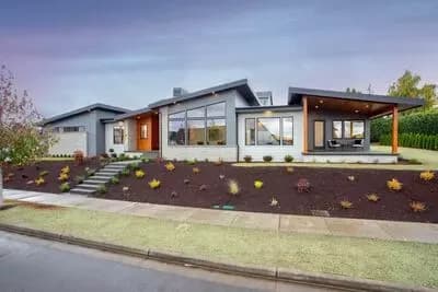 Contemporary Split Bedroom House Plan with Home Office and 3-Car Garage