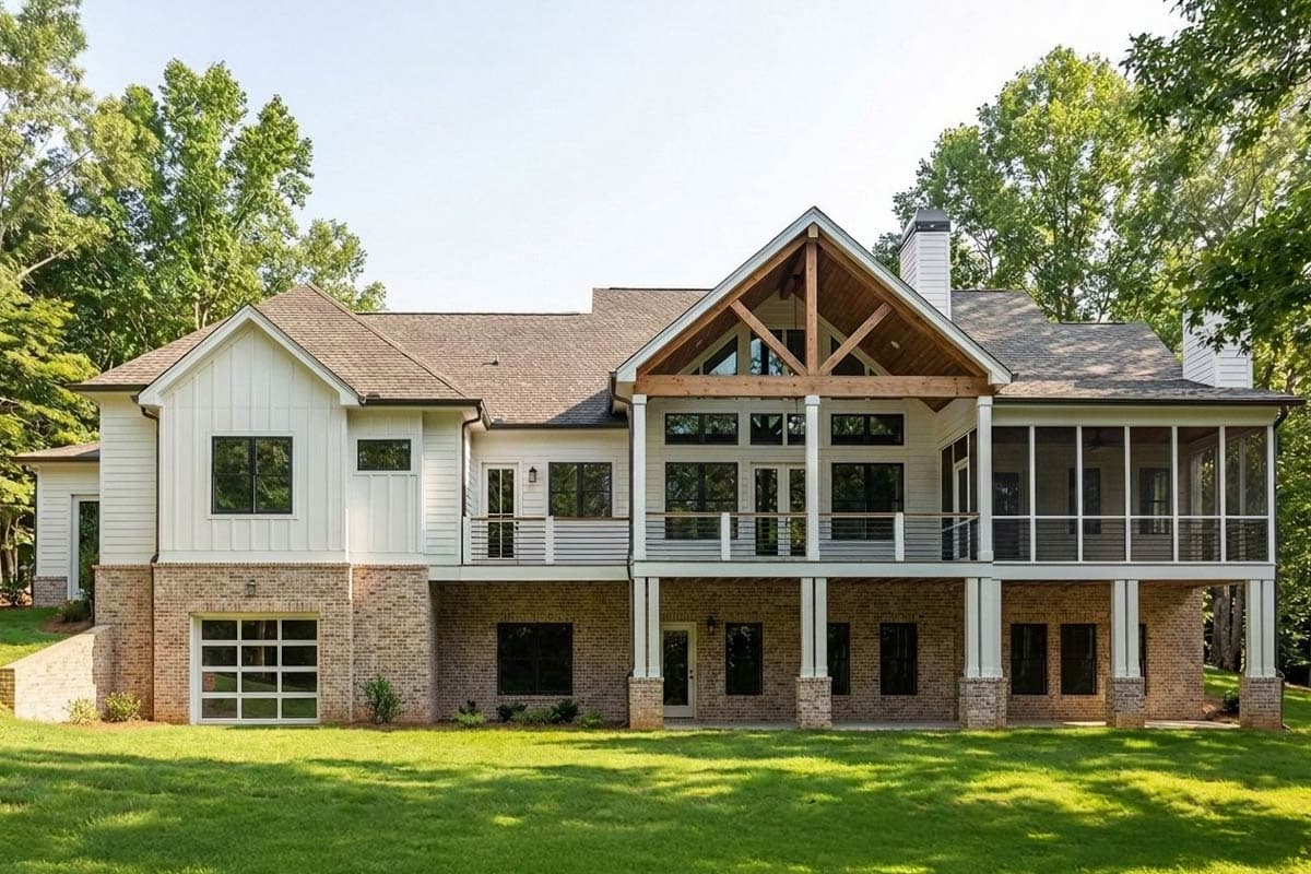 House plan exterior: Two-story modern farmhouse with a brick lower level, board and batten siding, exposed rafter tails, and a screened porch.