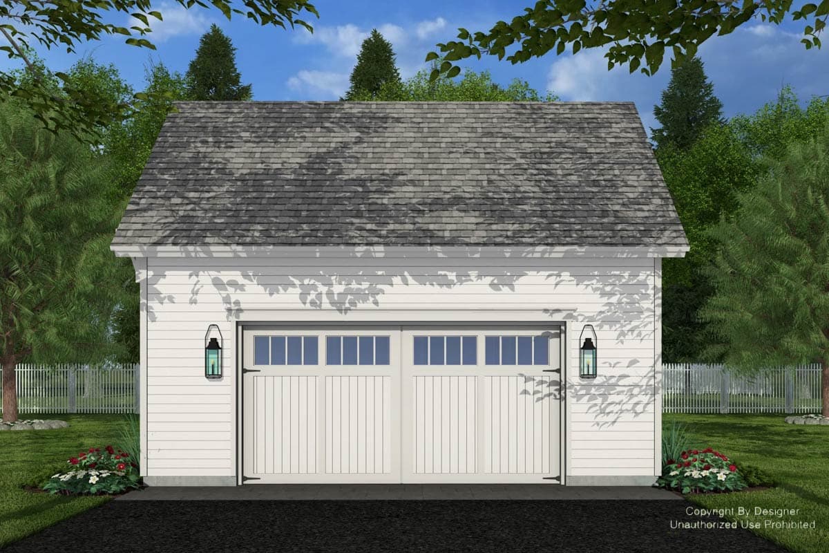 A white detached garage with a gray shingled roof, two overhead doors, and outdoor lanterns. Landscaping and a picket fence add to the curb appeal.