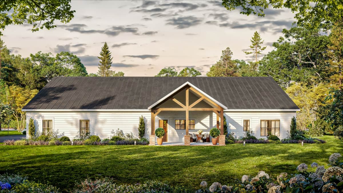 House plan exterior: Ranch style, white siding, dark metal roof, prominent gabled porch with exposed beams and brick supports.