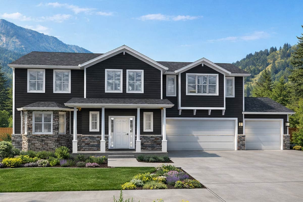 A two-story house with dark siding and white trim. Stone accents and a front porch are visible. Mountains and a blue sky are in the background.