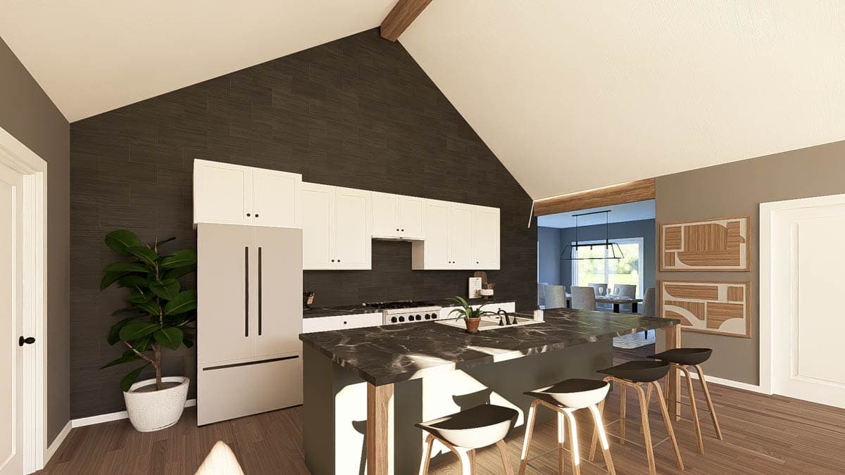 Open concept kitchen with vaulted ceiling, dark tiled backsplash, white cabinets, large island with seating, and dining area visible.