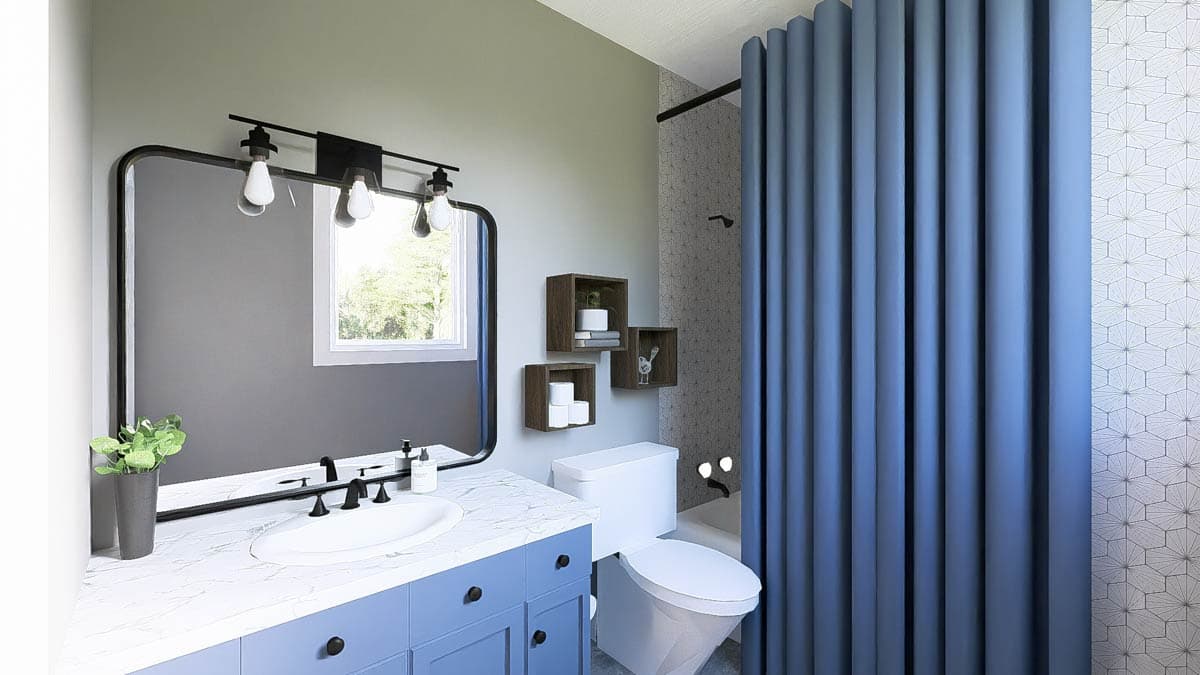 Modern bathroom with blue vanity, marble countertop, large mirror, toilet, and blue shower curtain.