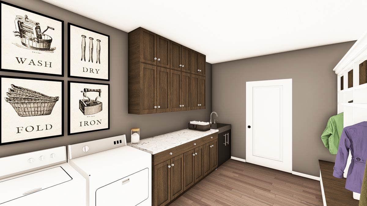 Laundry room with washer, dryer, dark wood cabinetry, sink, and wash, dry, fold, iron art.