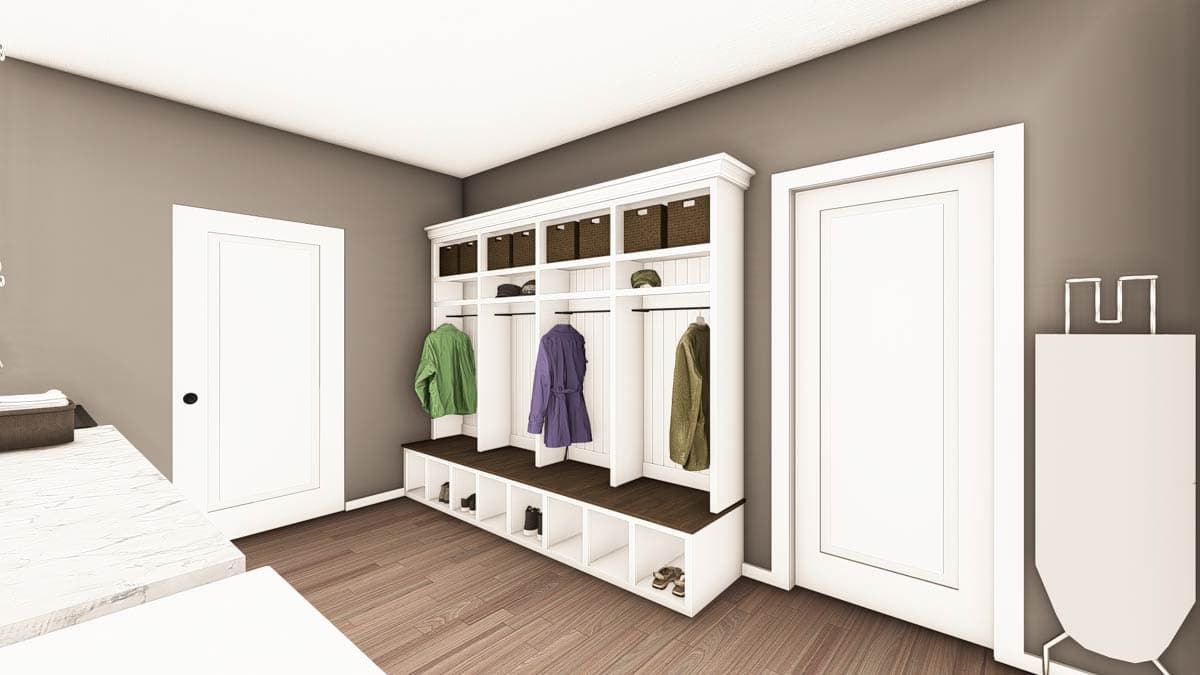Mudroom with built-in white cabinetry featuring cubbies for shoes, coat hooks, and storage baskets. Includes two white doors and wood flooring.
