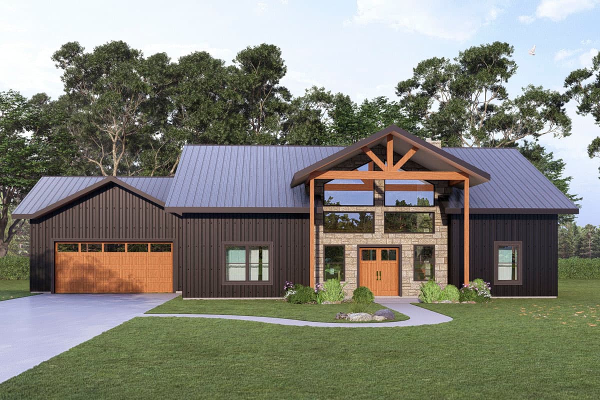 A modern, two-story house with dark siding, a metal roof, and large windows. The entryway features a stone facade and a wooden door.