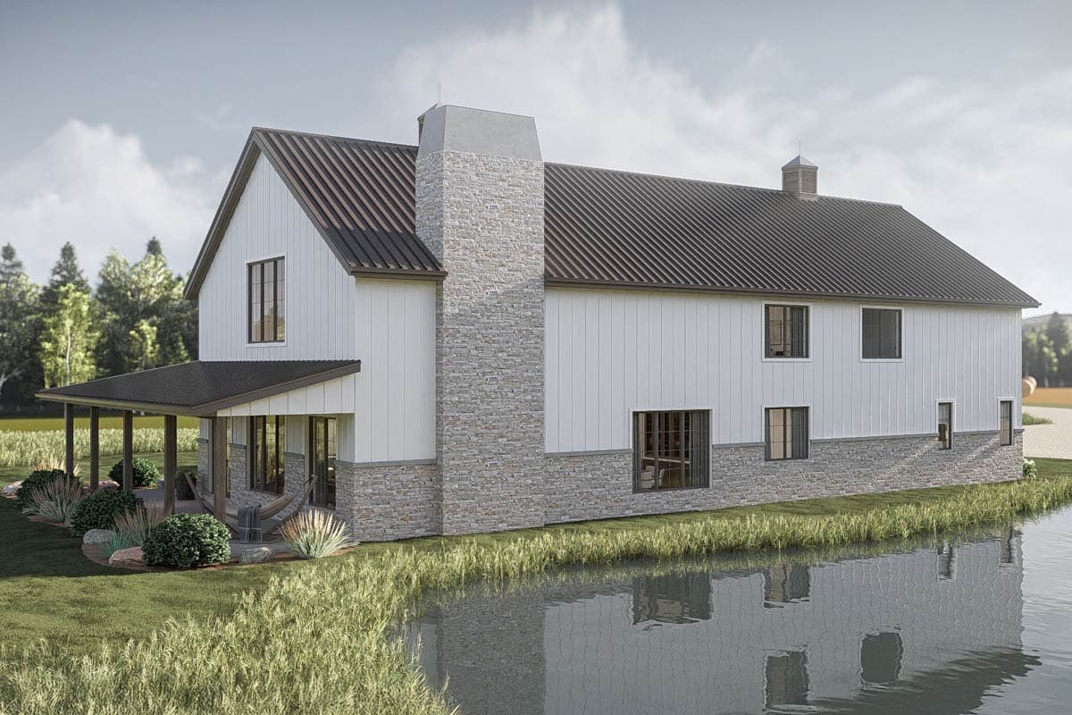 Modern farmhouse house plan exterior with white board and batten siding, stone base, gabled roof, and covered porch.