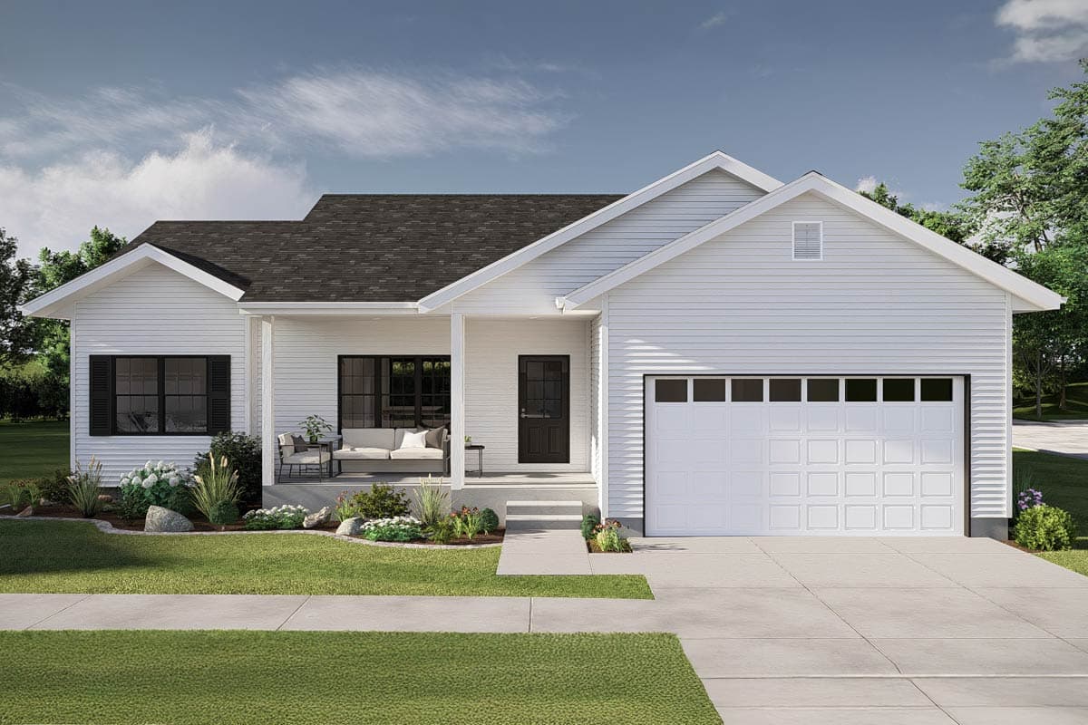 A modern, white-sided house with a porch, black front door, and a garage. The home is surrounded by landscaping and a concrete driveway.