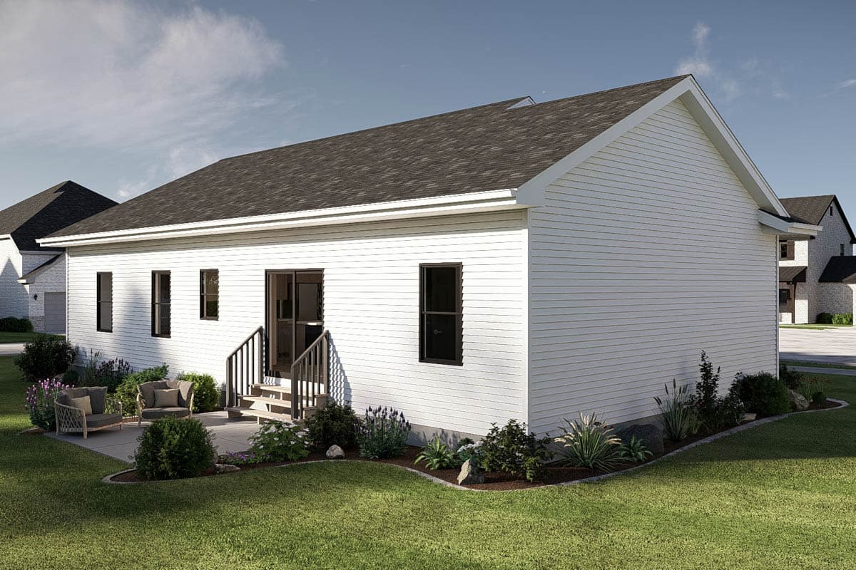 House plan exterior: Ranch style, single-story with vinyl siding, dark-shingled roof, and a patio with outdoor seating.