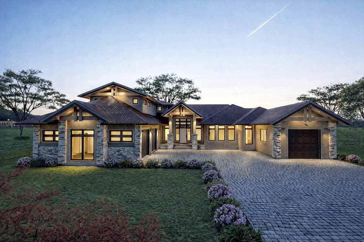 A modern, multi-gabled house with stone accents and a long driveway. The design incorporates a combination of materials and textures.