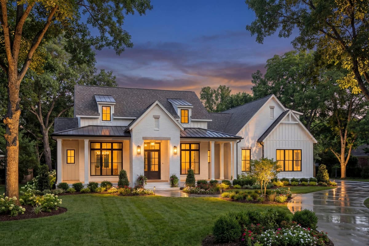House plan exterior. Modern Farmhouse style, two-story home with a covered porch, multiple gables, and a mix of brick and siding.