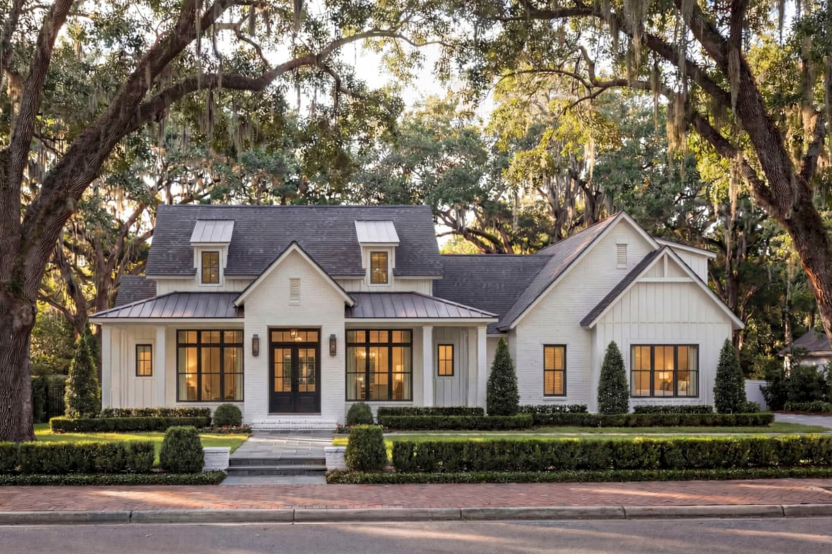 House plan exterior featuring a two-story Modern Farmhouse design. Includes a covered front porch, gable rooflines, and dormers.