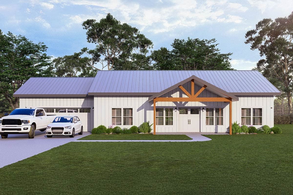 A modern, white farmhouse with a metal roof. A truck and car sit in the driveway. The home has a wooden-framed porch and a large yard.