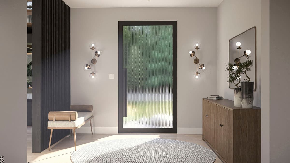 Entryway with fluted glass door, decorative sconces, wood console table, bench, and round rug.