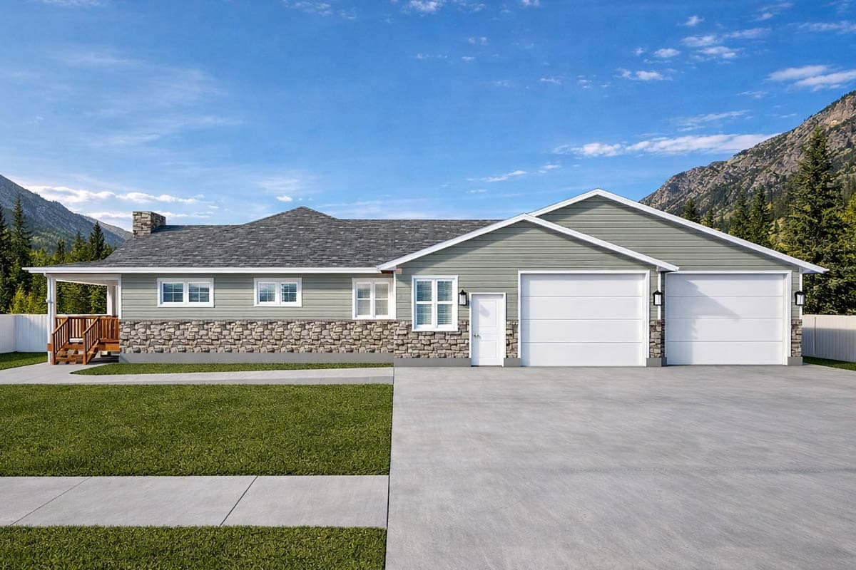 A house with green siding and stone accents sits beneath a blue sky. It has a garage, front porch, and mountains in the background.