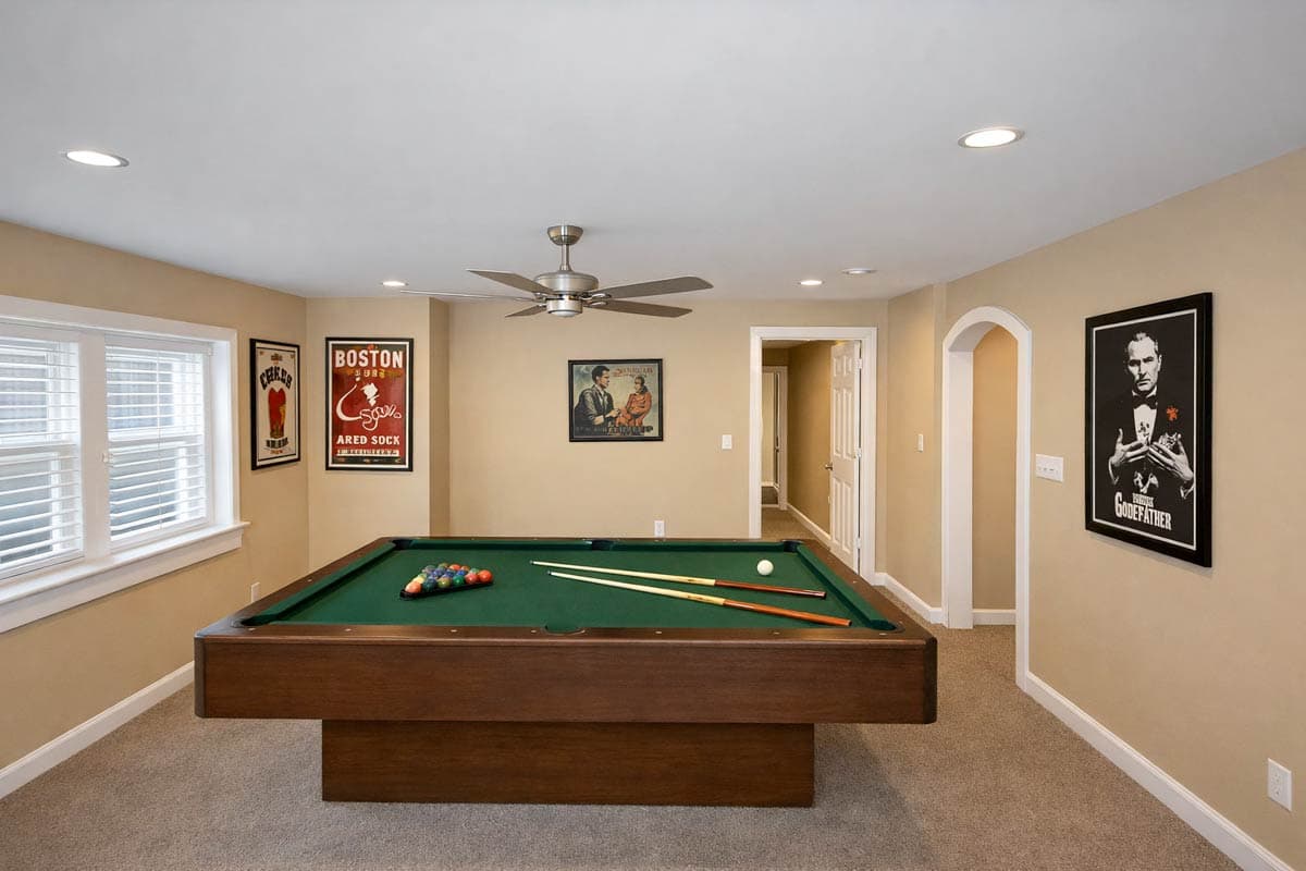 Billiard room with pool table, stacked baseball and movie posters, recessed lighting, and ceiling fan.
