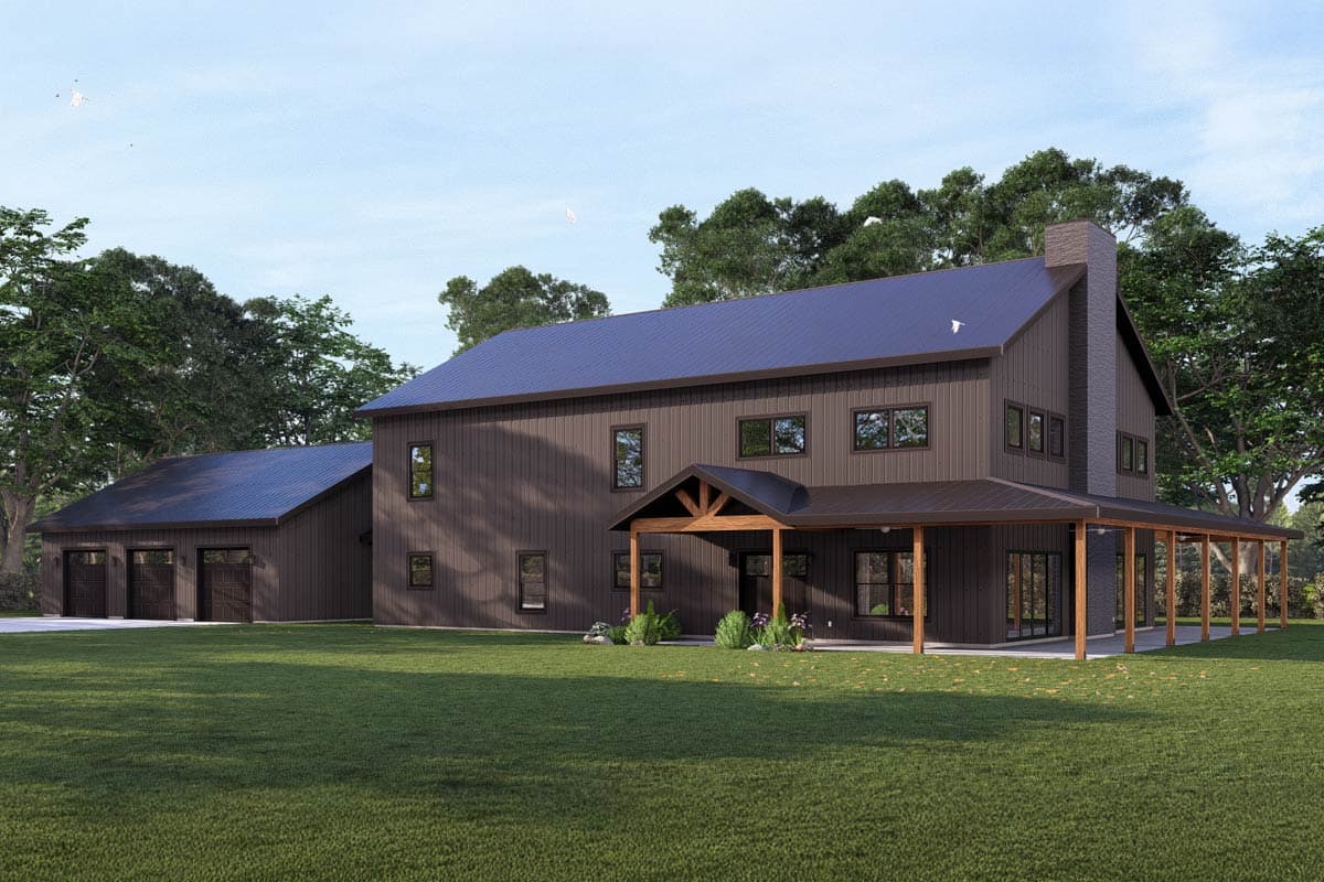 A modern, two-story house with dark siding and a blue roof. It features a porch with wooden supports, a garage, and a large lawn.