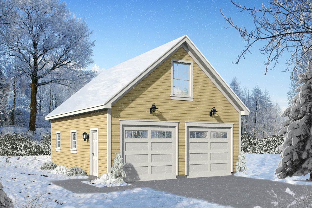 A two-car garage sits in a snowy landscape, a light yellow building with white garage doors, a small window, and snow-covered roof.