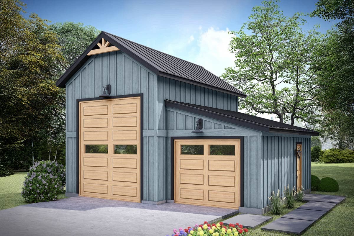 A detached two-car garage with a blue exterior and wooden doors. Lush greenery surrounds the structure, with a paved walkway leading to the entrance.