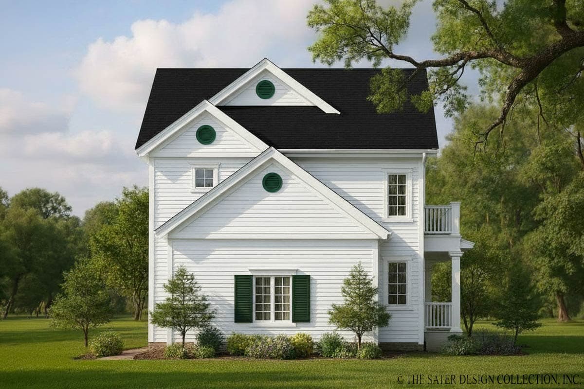 House plan exterior: two-story white home with intersecting gables, circular attic vents, and a second-story balcony.