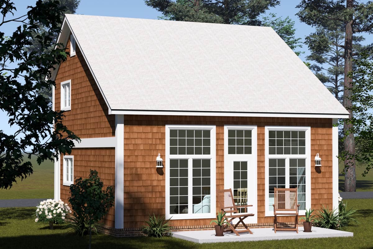 House plan exterior: Modern home with cedar shingles, white trim, gable dormer, and large grid-pane windows.