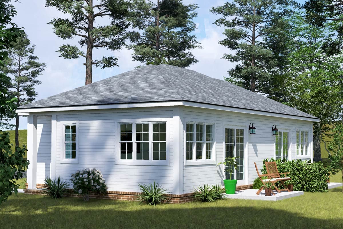 House plan exterior: One-story home with a hip roof, horizontal siding, multiple windows, and a small patio.