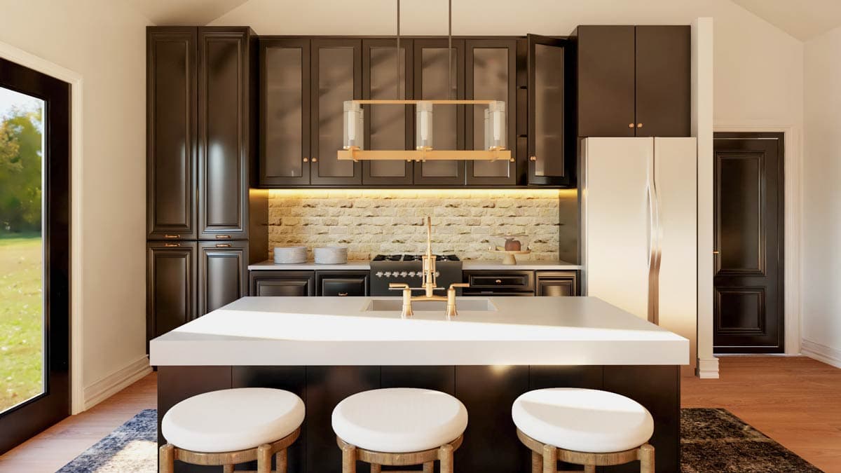 Kitchen with dark cabinetry, large island, brick backsplash, gas range, and vaulted ceiling.