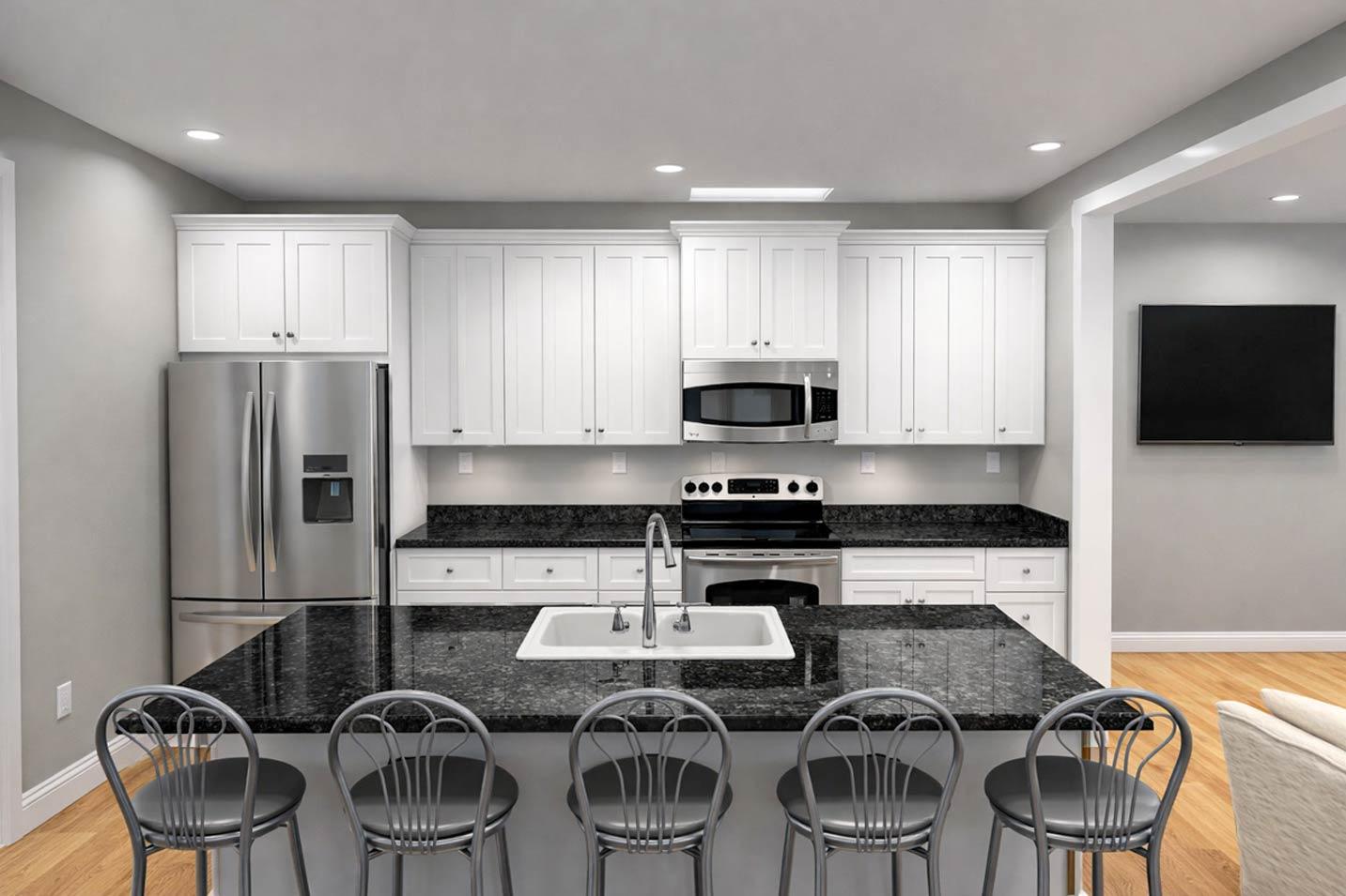 Modern kitchen with white shaker cabinets, granite countertops, stainless steel appliances, and a large island with seating.
