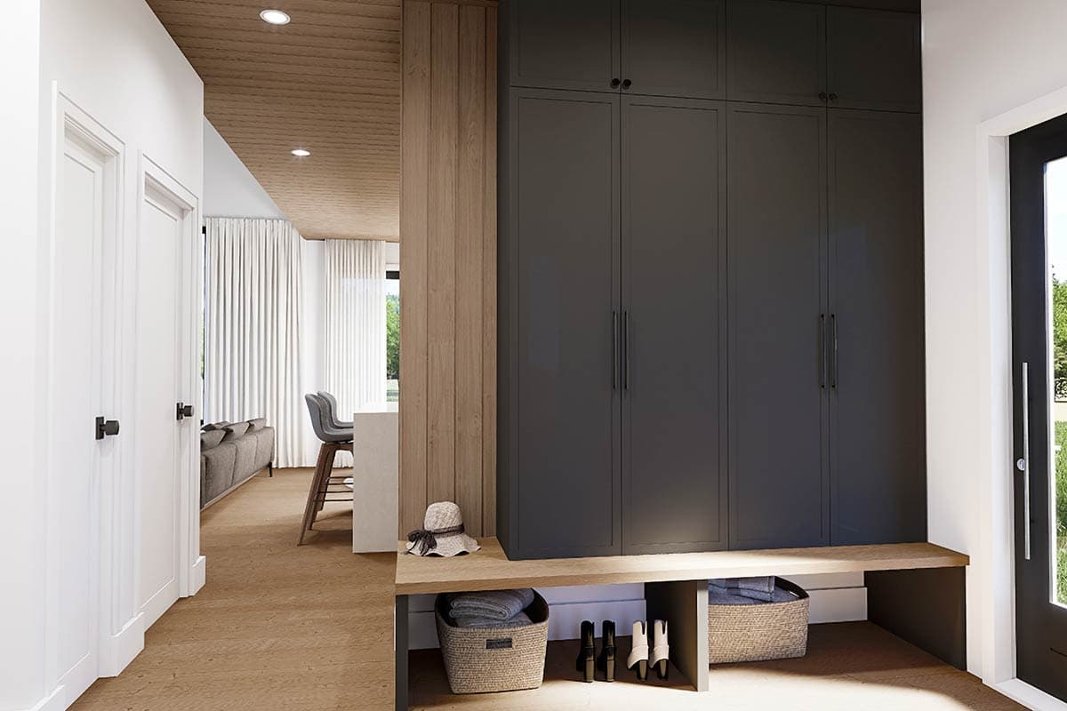 Interior rendering of a mudroom with dark gray cabinetry, wood paneling, built-in bench, and doorway to living area.