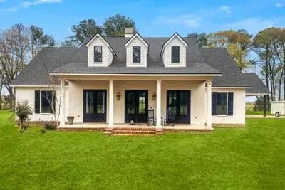 Acadian Style House Plan with 3 Bedrooms and a Side-Entry Carport