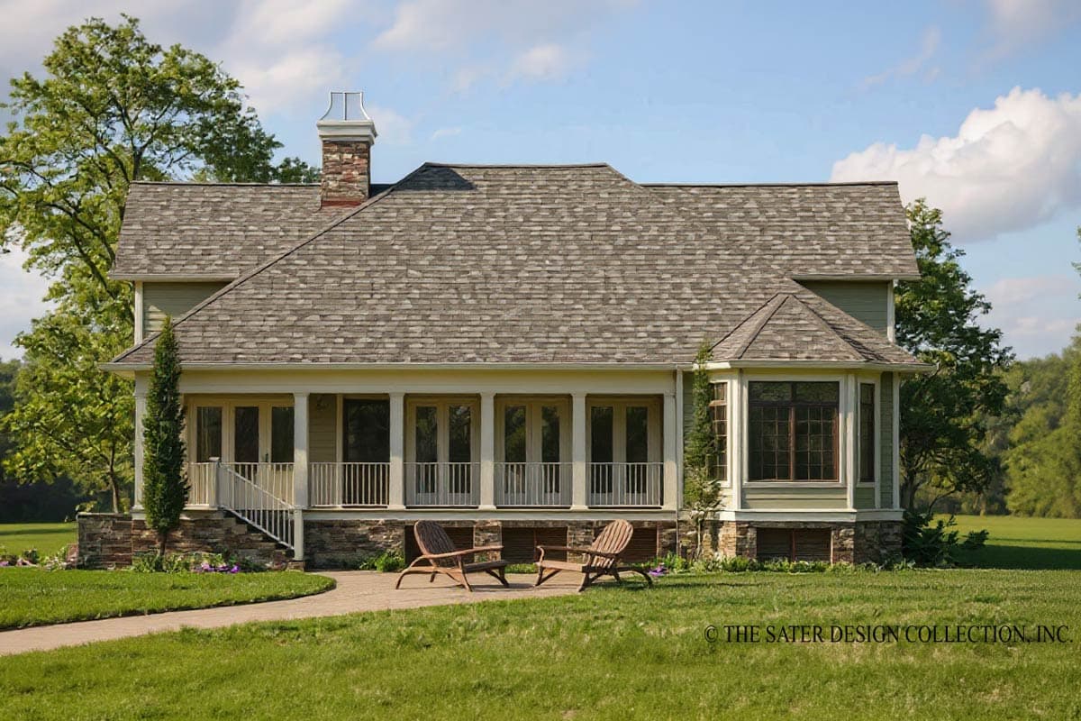 House plan exterior with a wraparound porch, stone foundation, bay window, and prominent chimney with decorative cap.