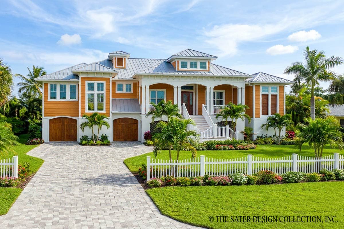 House plan exterior. Two-story home with a wrap-around porch, multiple dormers, and a prominent roofline over the entry.