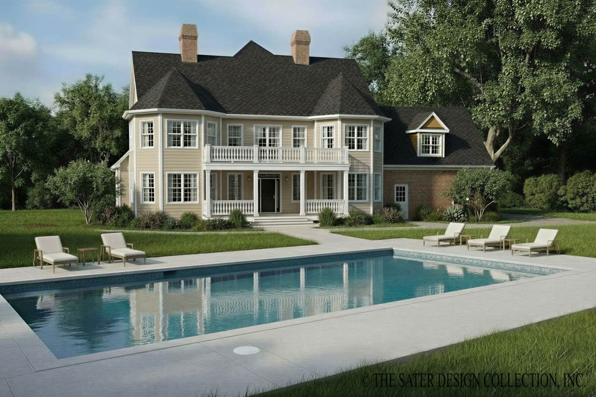 House plan exterior: two-story home with dormer window, covered balcony, and symmetrical facade with dual chimneys.