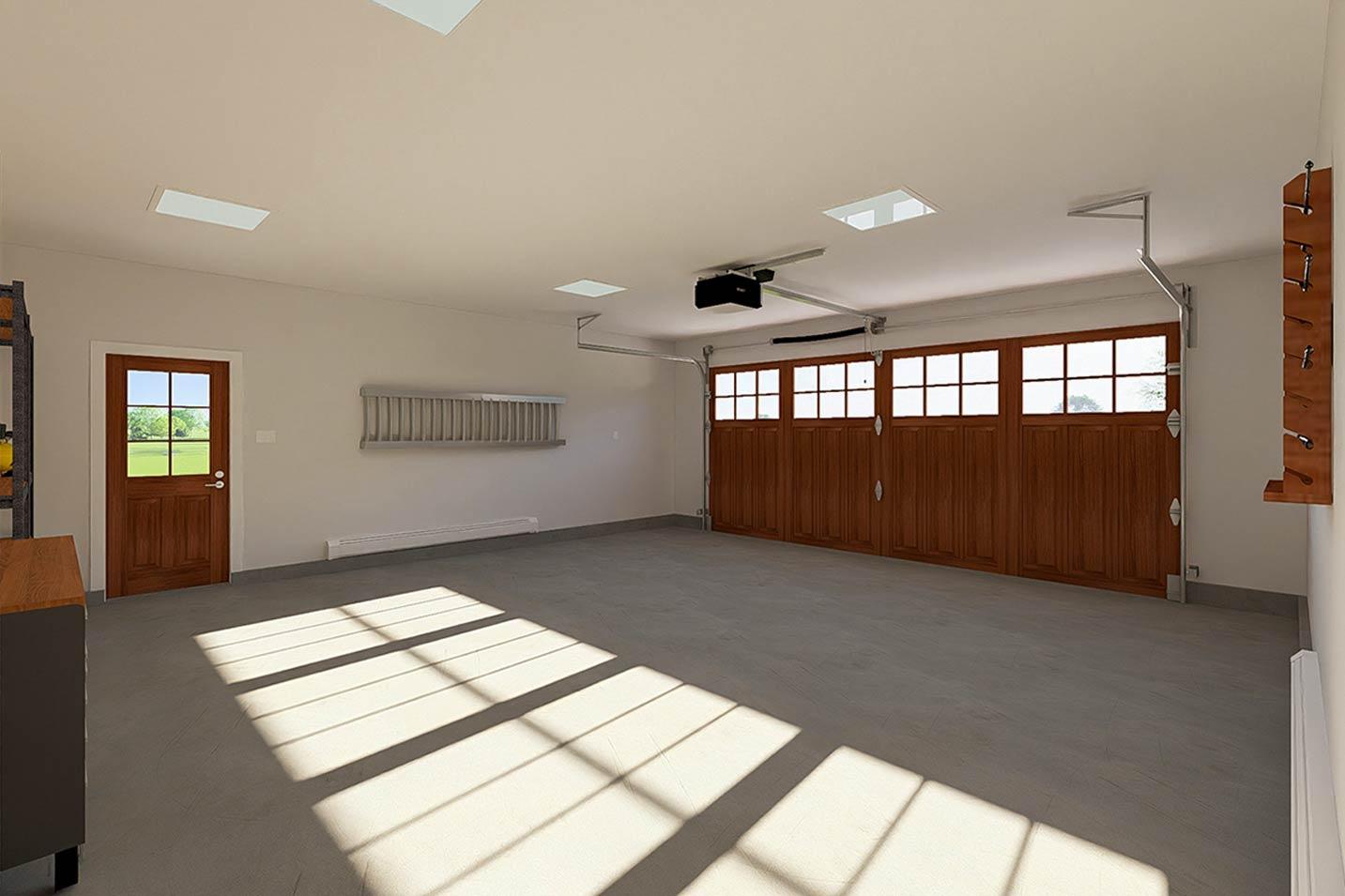 Interior view of a garage with two wooden garage doors with windows, a wooden side door, and skylights.