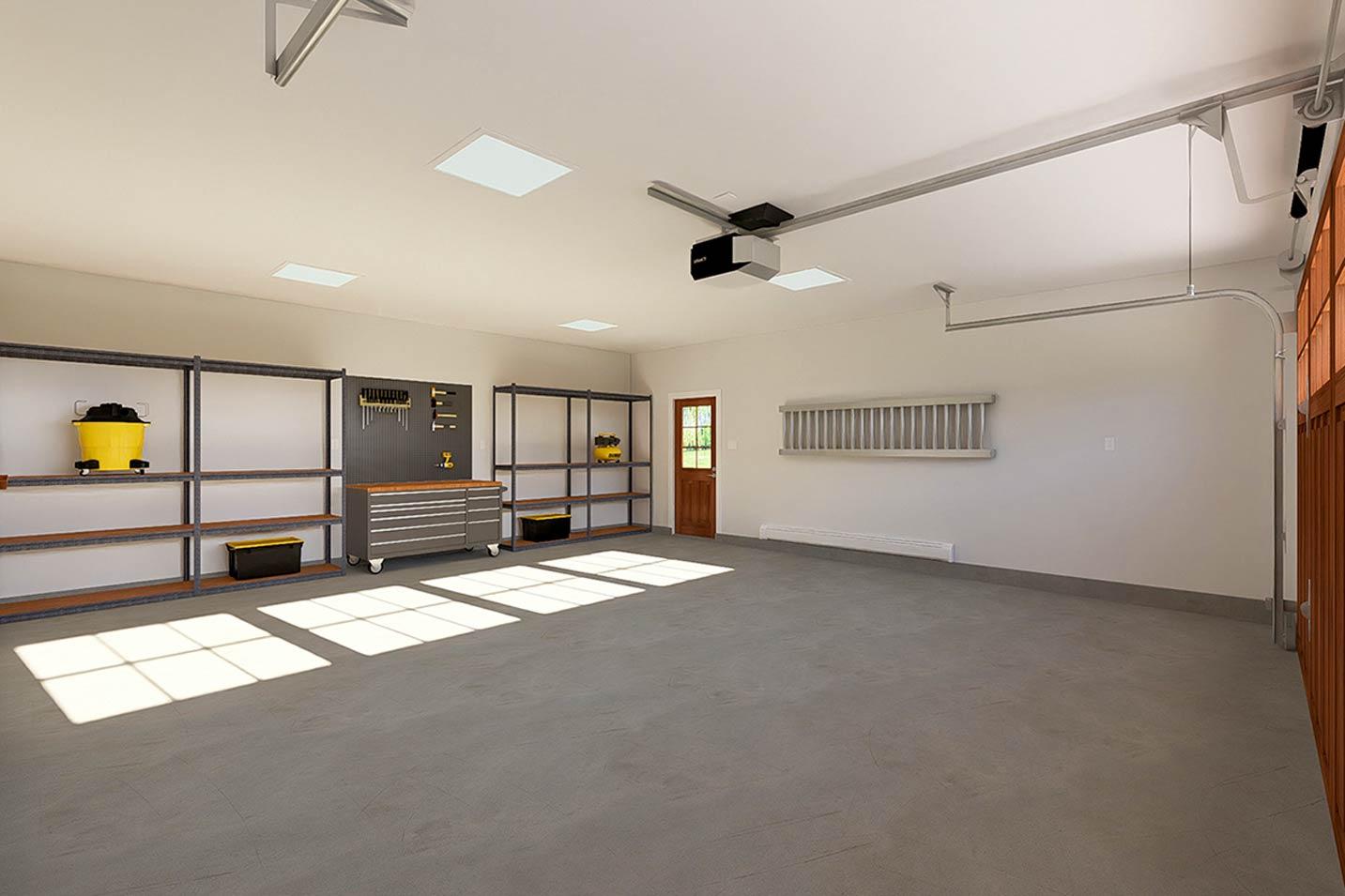 Spacious garage interior with shelving, tool chest, overhead door opener, and natural light from skylights.