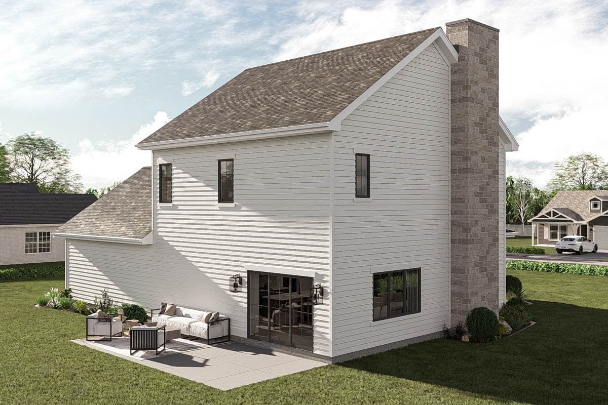 Two-story house plan exterior with white siding, stone chimney, gable roof, and double glass doors to patio.