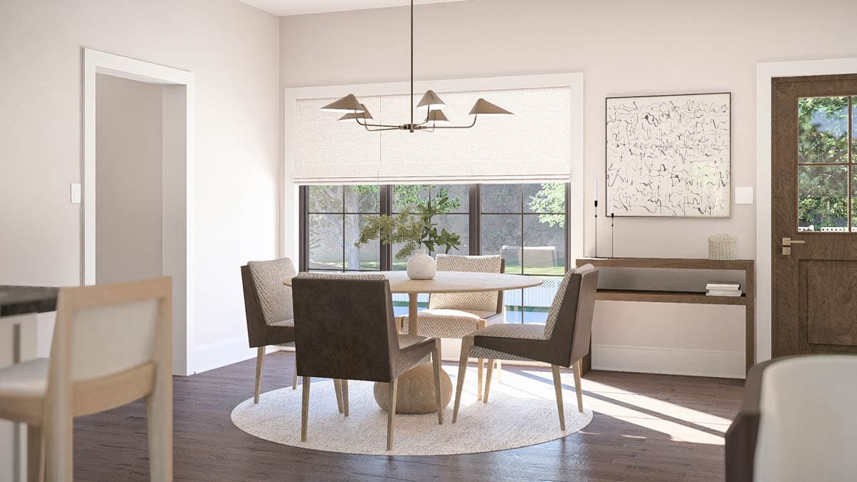 Dining area with round table, four chairs, pendant light, and large window with outdoor view.