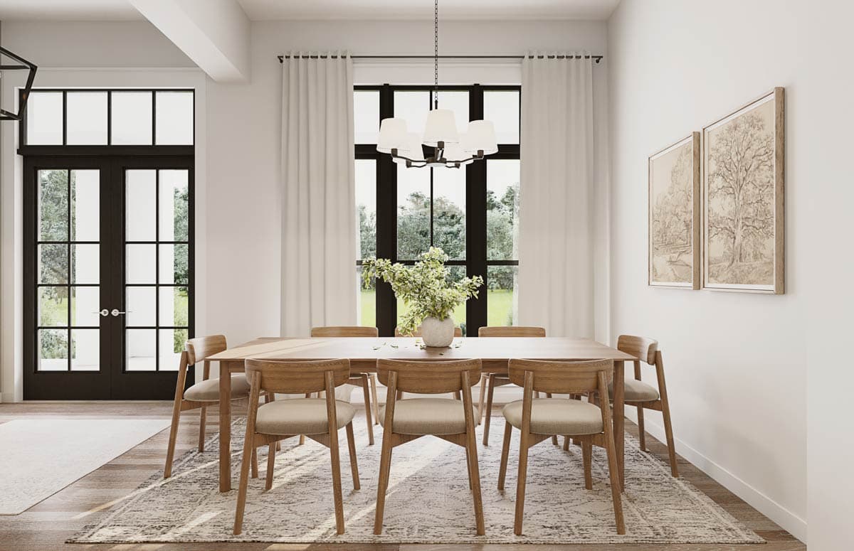 Dining room with a large window, chandelier, wood table and chairs. French doors visible to the left.