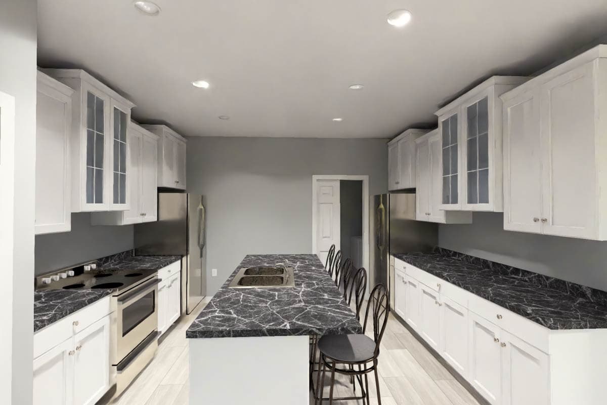 Kitchen with white cabinets, dark marble countertops, a large island with double sink, and stainless steel appliances.